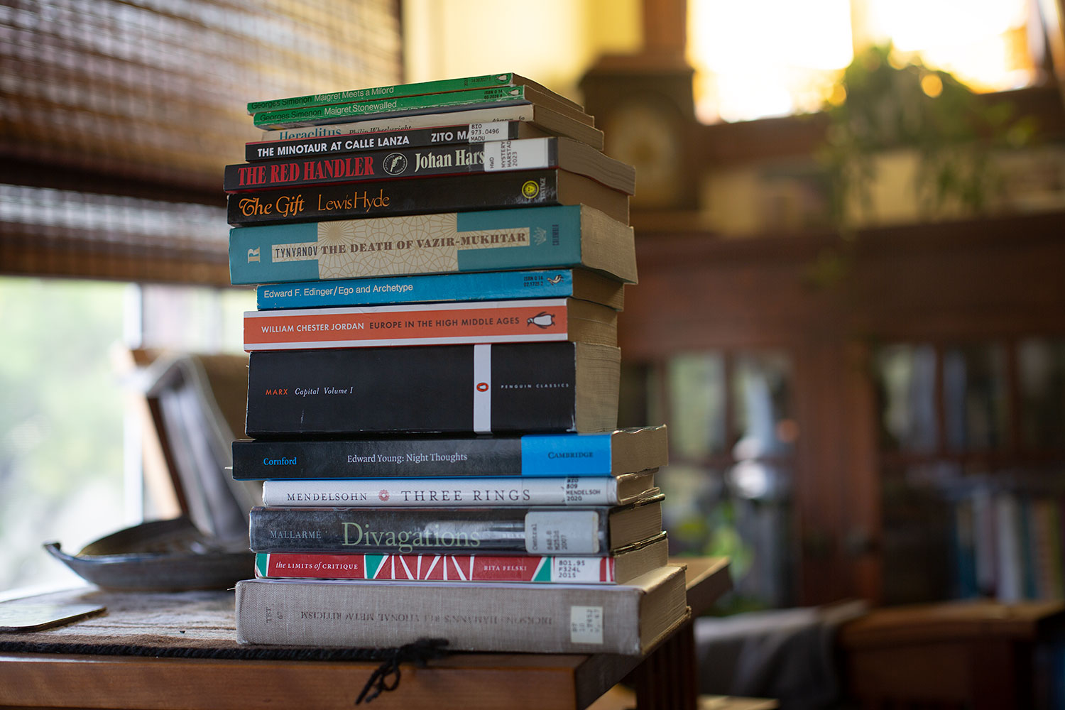 A rather tottering stack of books in a golden haze